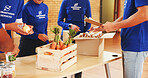 Teamwork, box and charity with people and food for help, donation or ngo project support. Social responsibility, grocery distribution or non profit campaign with hands of group for outreach program