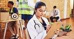 Charity, medical and writing with woman and clipboard for vaccine drive, outreach program and volunteer. Healthcare support, doctors without borders and ngo with person in community center for clinic