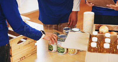 Buy stock photo Food, help and hands of volunteers with donation for community service, social project or charity. Groceries, giving and NGO workers with collaboration for distribution of canned goods for outreach.