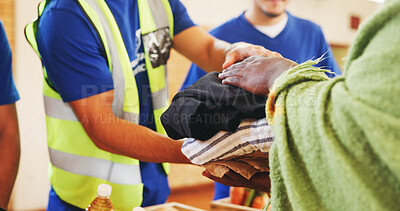 Buy stock photo Clothes, help or hands with donation for homeless person, social project or community relief. Charity, group or people giving blankets for humanitarian aid, distribution or winter with support at NGO