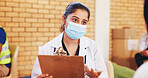 Clipboard, consulting and face mask with doctor in community center for healthcare checkup. Documents, insurance and volunteer with medical professional at outreach event for charity or medicare