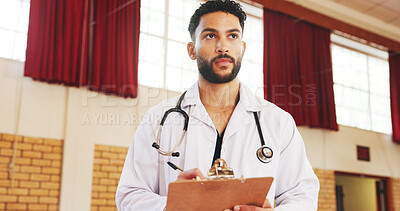 Buy stock photo Charity, medical and help with man and clipboard for vaccine drive, outreach program and volunteer. Healthcare support, doctors without borders and ngo with person in community center or clinic