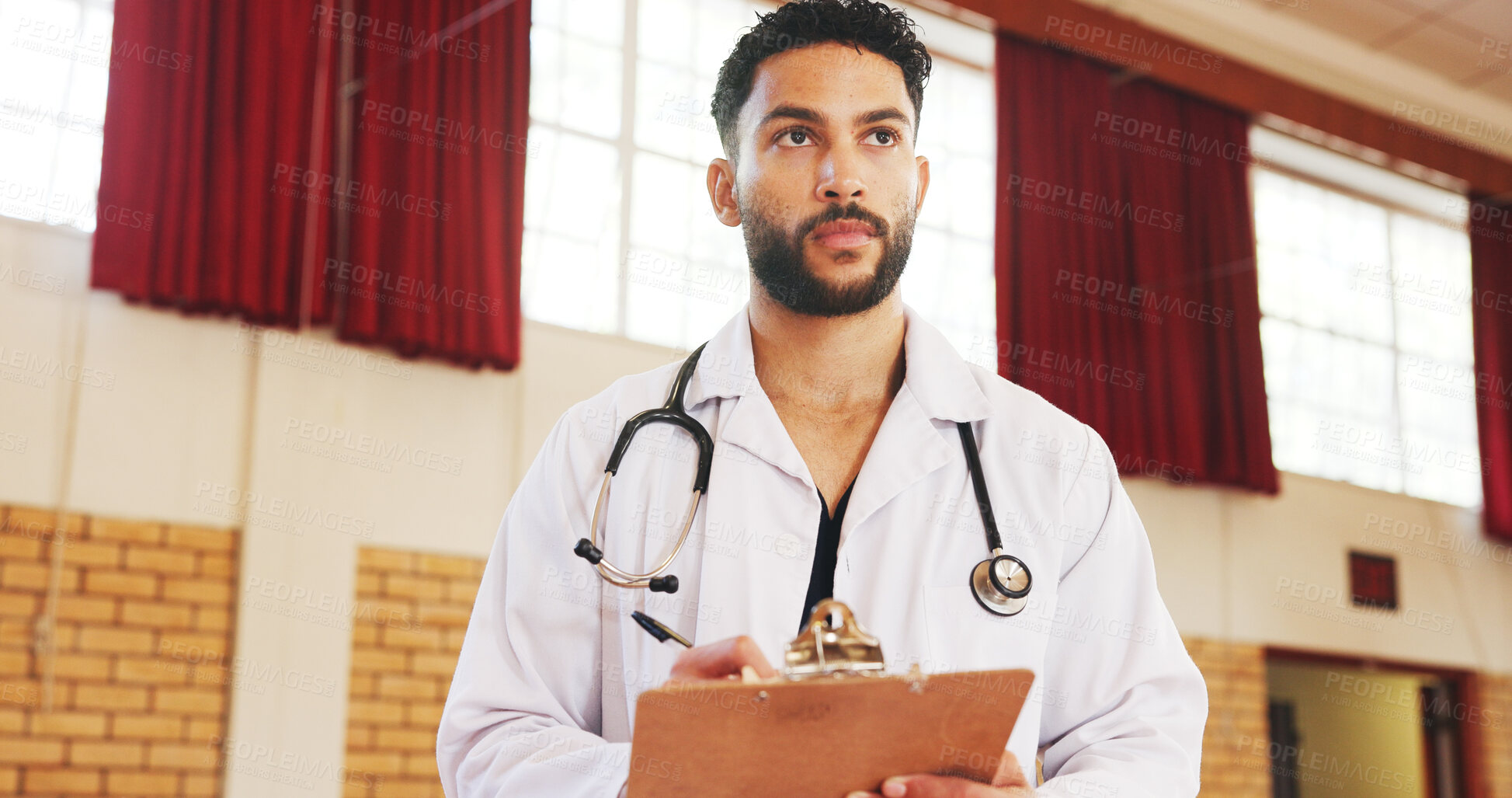Buy stock photo Charity, medical and help with man and clipboard for vaccine drive, outreach program and volunteer. Healthcare support, doctors without borders and ngo with person in community center or clinic