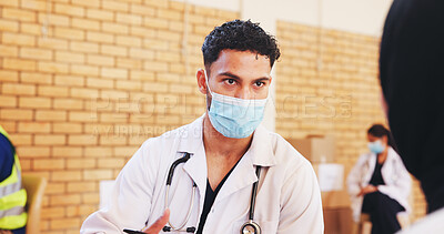 Buy stock photo Healthcare, patient and man with mask, doctor and volunteering to control outbreak and consultation. Nonprofit, people and medical professional with protection for MERS CoV, diagnosis or treatment