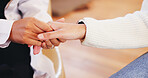 Holding hands, closeup and person with doctor for comfort for diagnosis, help and support. Healthcare, hospital and patient with health worker for medical service, consulting and empathy in clinic
