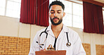 Doctor, clinic and man writing on clipboard for health, notes and insurance registration. Medical worker, checklist and serious professional with wellness report, results and information in hospital