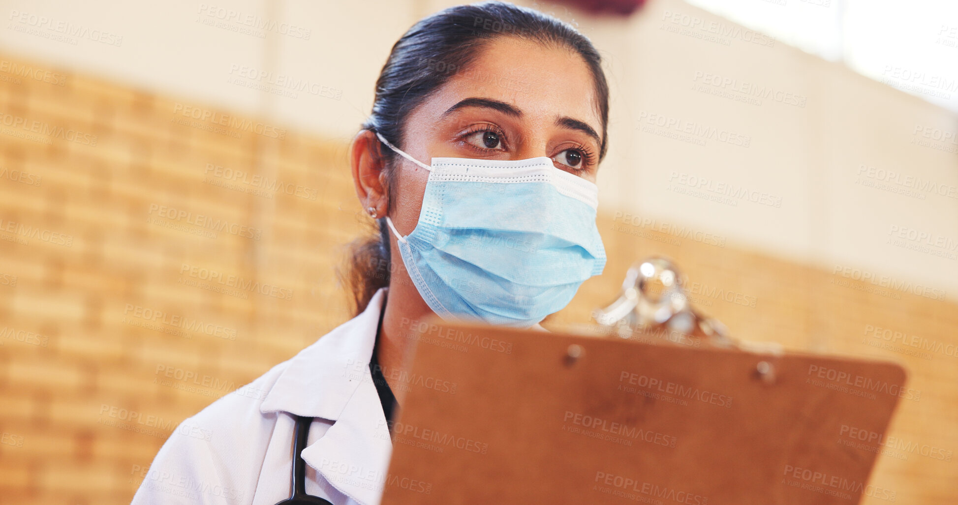 Buy stock photo Charity, medical and face mask with woman and clipboard for vaccine drive, outreach program and volunteer. Healthcare support, doctors without borders and ngo with person in community center