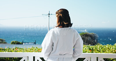 Buy stock photo Outdoor, balcony and back of woman at resort for travel, vacation or getaway with view in morning. Calm, ocean and female person in robe with hospitality at holiday apartment, hotel or accommodation.