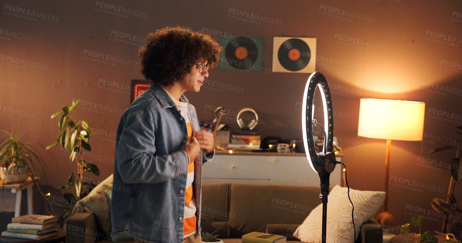 Buy stock photo Man, influencer and fashion with ring light at house for introduction, late live stream and social media. Night, content creator and review outfit for audience, recording video and styling tips
