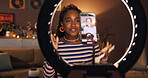 Woman, influencer and phone with ring light at house for introduction, live streaming and social media. African person, content creator and wave to audience, filming video and vlog tutorial with tips