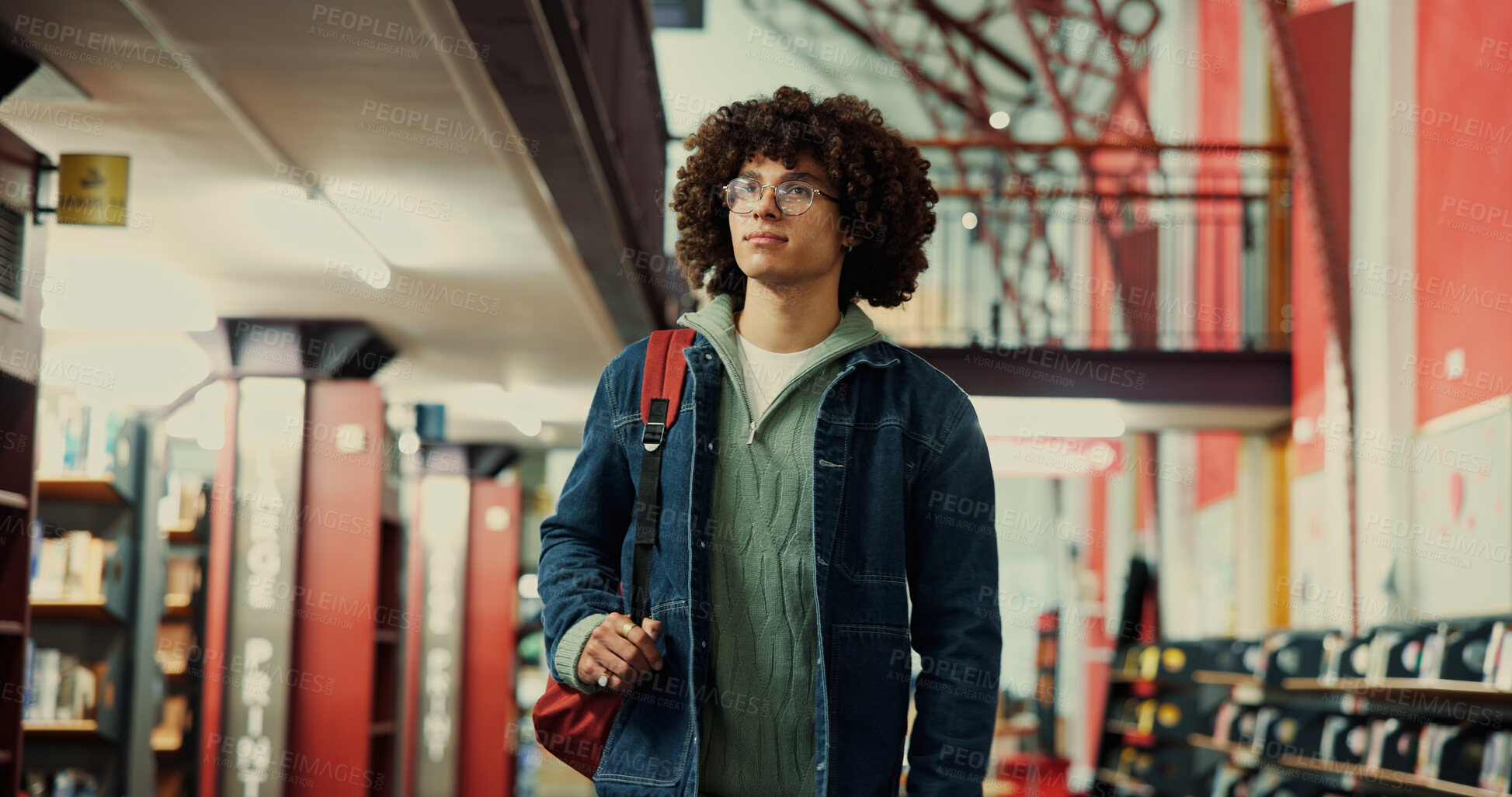 Buy stock photo Thinking, university and student or man in library for learning, research project or study vision. College reflection, scholarship opportunity and knowledge with person on campus for school course