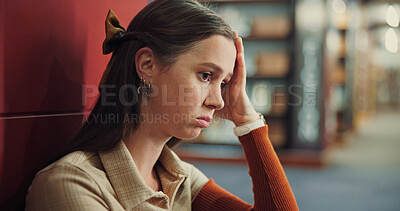 Buy stock photo College student, girl and thinking with stress in library for test fail, difficult exam or burnout. Education, campus and person with depression on floor for assignment deadline and workload pressure