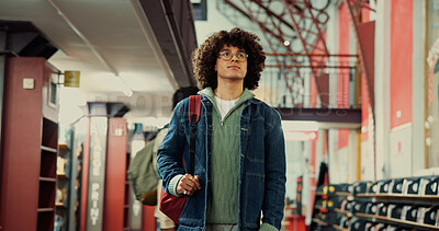 Buy stock photo Walking, student and thinking with man in library for reflection, university project or study resources. College vision, scholarship opportunity and knowledge with person on campus for school course