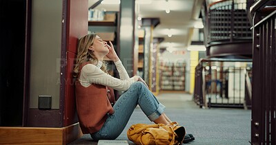 Buy stock photo University student, girl and stress on library floor for exam workload, test fail or study fatigue. Education, overwhelmed and person with anxiety on campus for academic pressure, brain fog and tired