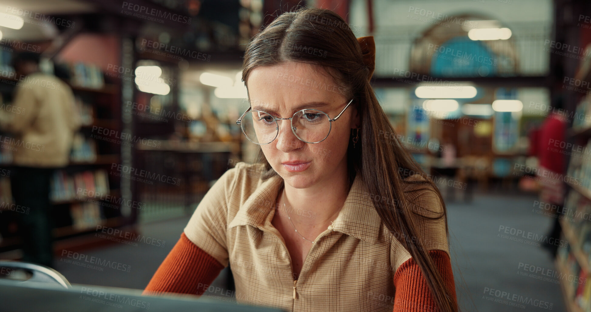 Buy stock photo Student, serious woman and computer in library for learning, education or problem solving in college. University, technology and girl on internet to research thesis, studying knowledge or scholarship
