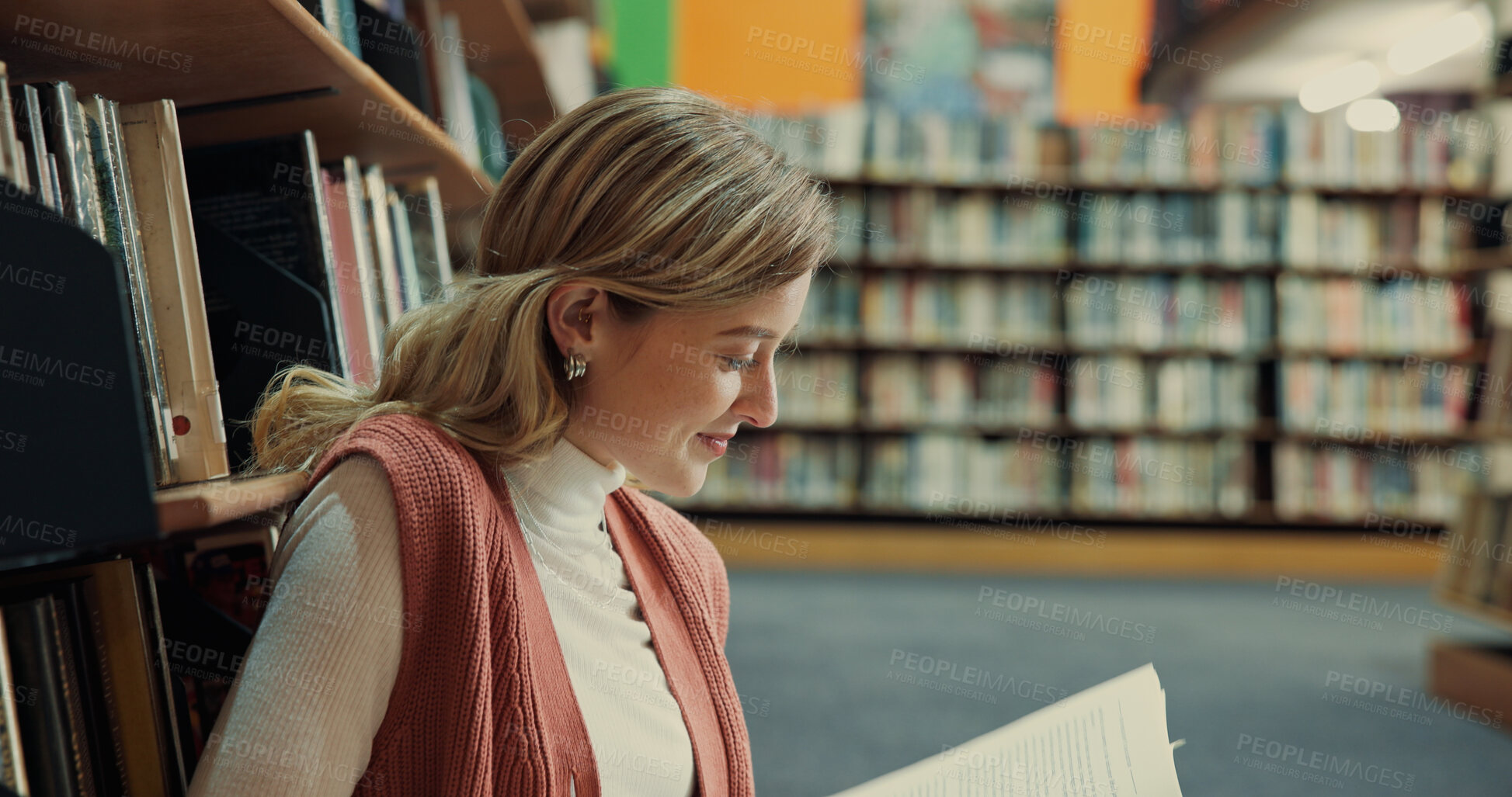 Buy stock photo Student, textbook and girl in library with reading, assignment or thesis research by bookshelf. Information, studying and person with education, prepare for exam or learning on university campus