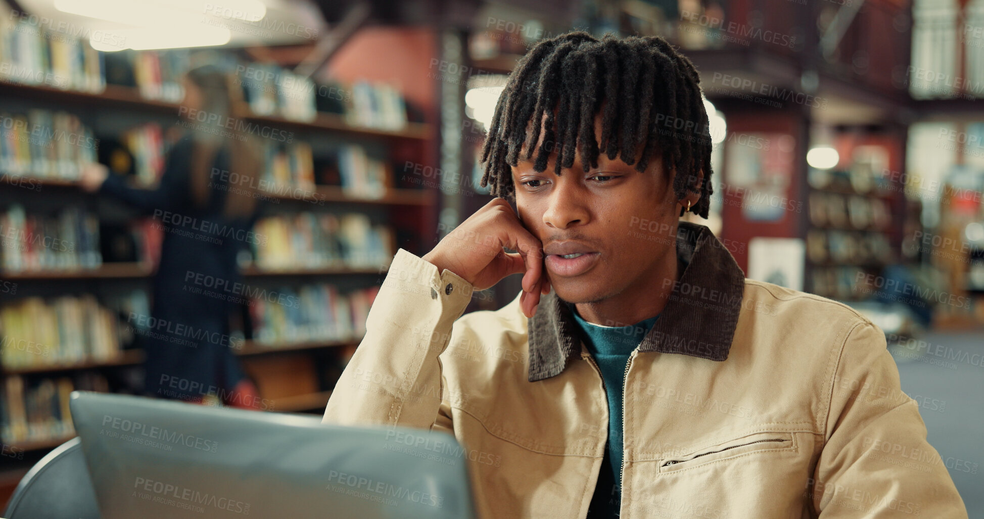 Buy stock photo Student, man and laptop in library for college studying, research and thinking for learning resource. Serious, confused and person reading online for university education, knowledge or scholarship