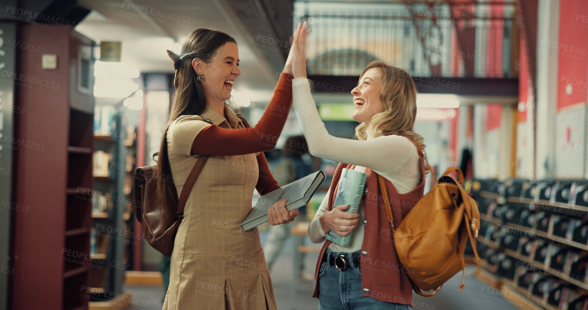Buy stock photo Students, success and high five with friends in library for application approval, support and college. Scholarship award, university team and achievement with women on campus for study and goals