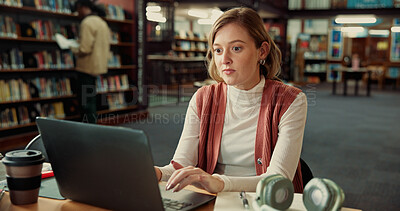Buy stock photo Learning, college student and typing on laptop in library for education or notes revision. University, computer and woman on internet to research assignment, study and concentration for scholarship