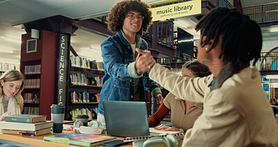 Buy stock photo Group, handshake and college with friends in library for education, welcome and student life. Assignment resources, greeting and study habits with people on campus for school scholarship and hello