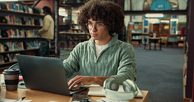 Buy stock photo Student, man and typing on laptop in library for learning, education or online quiz in college. University, technology and person on internet to research thesis, studying knowledge or scholarship