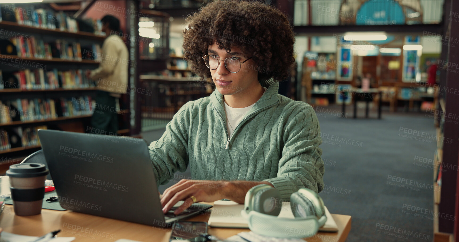 Buy stock photo Student, man and typing on laptop in library for learning, education or online quiz in college. University, technology and person on internet to research thesis, studying knowledge or scholarship