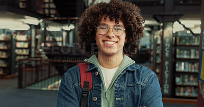 Buy stock photo University student, happy and man with backpack in library for night study, education or learning. Portrait, college campus and gen z person with evening productivity for essay deadline or assignment