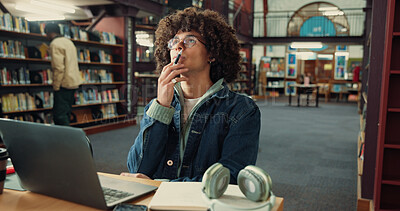 Buy stock photo Thinking, student and man with laptop, library and idea for assignment on web, online or reflection. Contemplating, serious and person with tech for exam, knowledge or planning for project in college