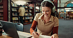 University, headphones and woman on laptop in library for online assignment, studying and test. College, happy and student with music on computer for research notes, education and learning on campus