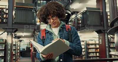 Buy stock photo Library, man and student with reading book for learning, assignment information and exam on campus. College, male person and glasses with english literature for education, studying and novel for test