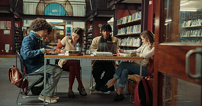 Buy stock photo Laptop, books and group of students studying in library for university test, project or exam. Education, notes and friends preparing for college assignment together with scholarship at campus.