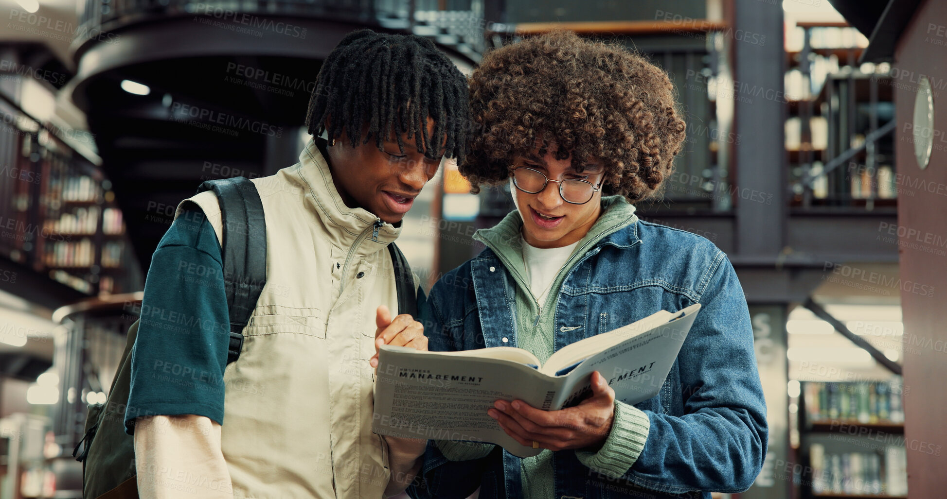 Buy stock photo People, students and book for education in library by studying, information and exams. Men, friends and reading textbook for research, knowledge and learning for assignment of scholarship preparation