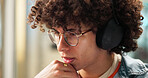 Thinking, student and man with headphones for project, learning and studying for school test. University, college and thoughtful person with glasses listening to music, audio or podcast for education