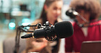 Talking, mic and blur of people for podcast, interview and discussion for content creation. Equipment, live streaming and host with guest for conversation, chat and audio broadcast for radio show