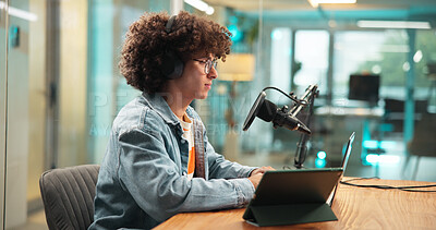 Buy stock photo Laptop, headphones and man with microphone for broadcast, podcast and radio host. Computer, reading and live streaming in studio with audio equipment for editing show, production and content creation