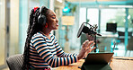 Talking, headphones and black woman on podcast with microphone for broadcast or radio host. Laptop, happy person and live streaming in studio for show, production or content creation for social media