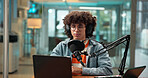 Man, laptop and headphones with mic in studio, recording podcast and sound check for broadcast. Male person, equipment and audio of news announcement, radio channel and hosting show for entertainment