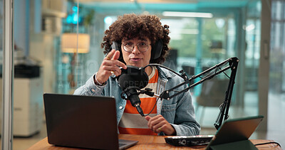 Buy stock photo Pointing, headphones and man with microphone for podcast, broadcast and radio host with laptop. Portrait, live recording and streamer talk in studio for announcement, news and communication in POV