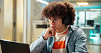 Thinking, student and man with headphones on laptop for research, learning and studying for test. University, college and person listen to music to concentrate for education, online exam or knowledge