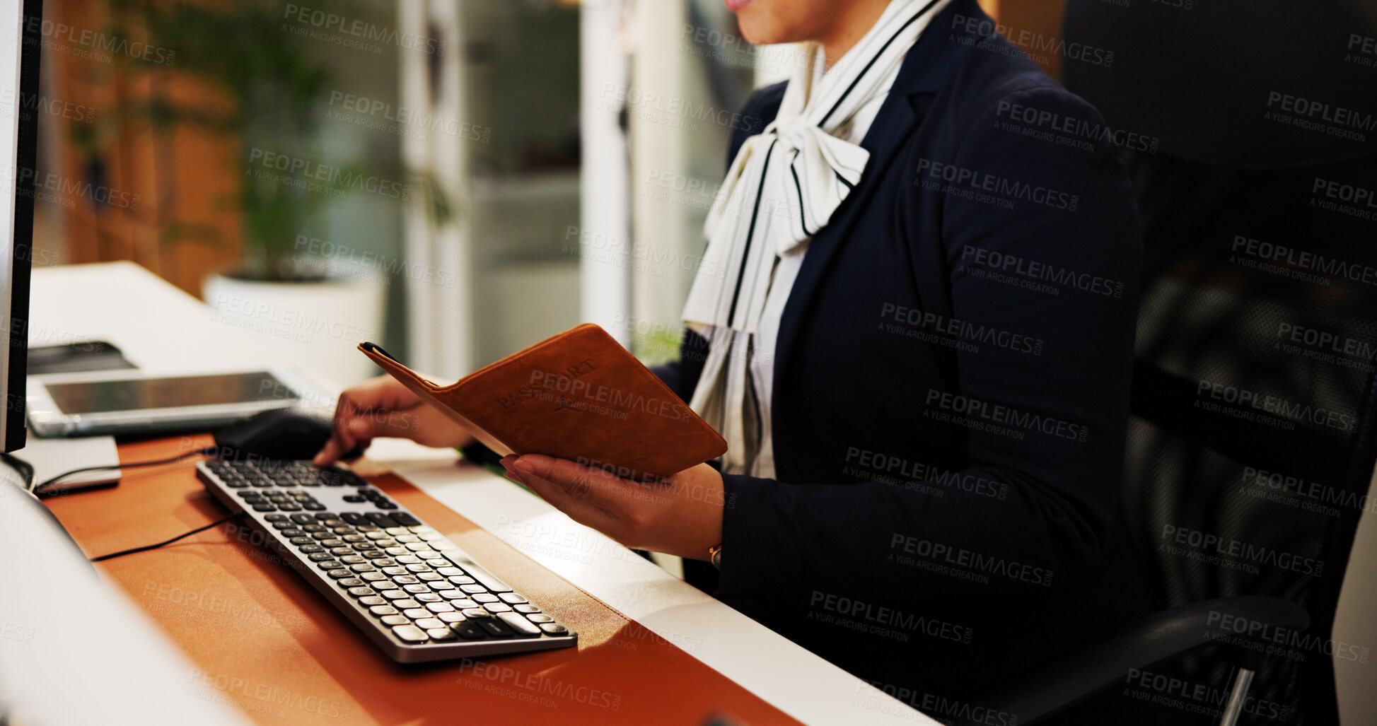 Buy stock photo Receptionist, hands or computer with passport at hotel for check in, reservation or online booking. Hospitality industry, concierge typing and woman with personal info for accommodation confirmation
