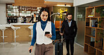 Hotel, smartphone and woman in lobby, internet and confidence with travel business, luggage and app. Person, entrepreneur and guest in hallway, hospitality and cellphone with connection and texting