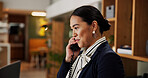 Woman, phone call and happy at hotel, help desk and talk with client for booking information. Person, concierge and receptionist with telephone, contact and listen with hospitality service at lodge 