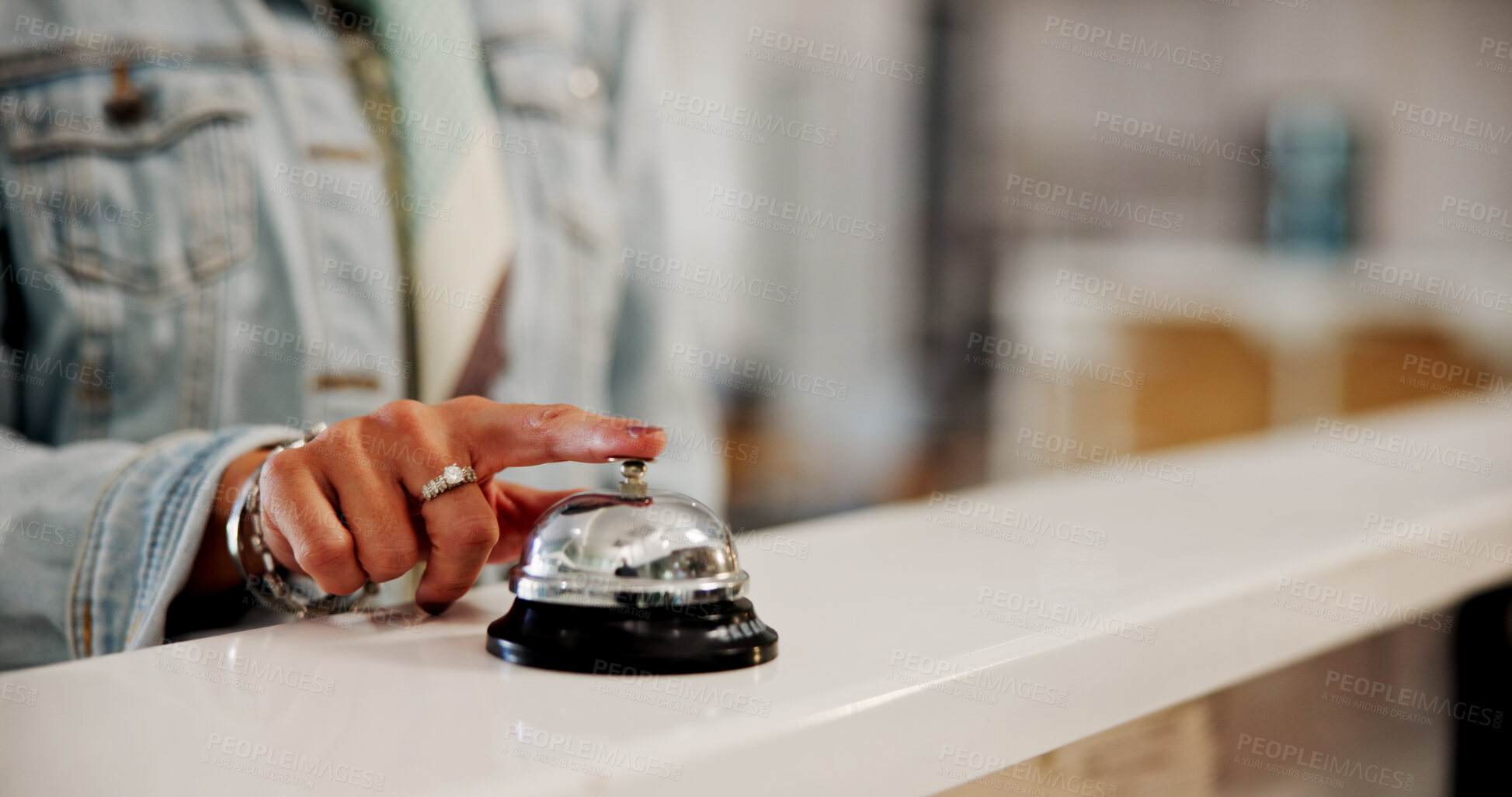 Buy stock photo Press, bell and guest in hotel, urgent and signal for request, attention and reception for check in. Holiday, help desk and person with reservation, space or hands with buzzer for assistance in motel