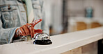 Person, hands and ring with bell for service, alert or attention at hotel front desk. Customer, finger and ringer with alarm, request or calling concierge for accommodation, hospitality or assistance