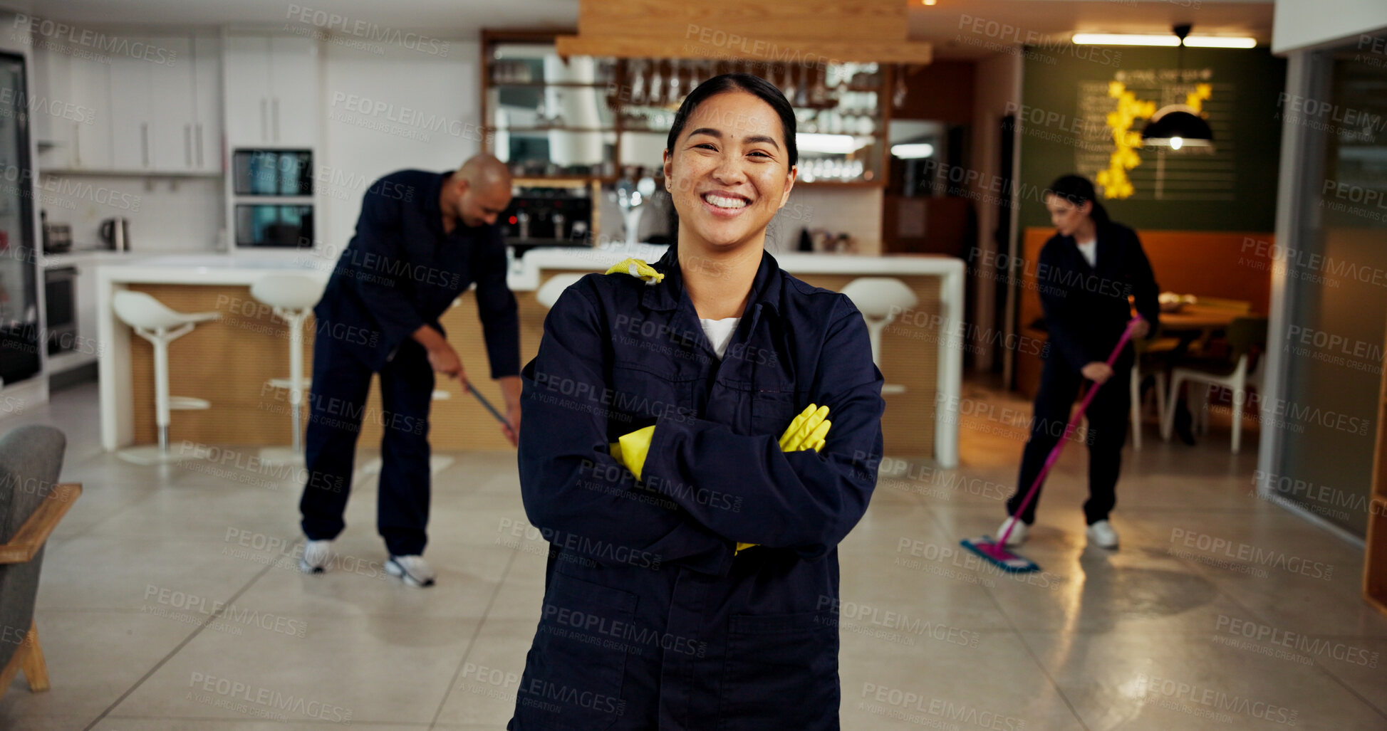 Buy stock photo Woman, portrait and janitor with smile for maintenance job, hygiene and arms crossed with team in uniform. Pride, happy and cleaner with colleagues mop floors, overalls or confident at workplace