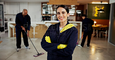 Buy stock photo Woman, portrait and janitor with smile for maintenance job, hygiene and arms crossed with team in uniform. Pride, happy and cleaner with colleagues mop floors, overalls or confident at workplace