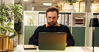 Buy stock photo Man, laptop and night at startup, research and typing for report, project and deadline in office. Person, editor and computer with reading, feedback or review process with overtime at creative agency