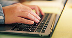 Laptop, research and hands of businessperson typing in office at night with research for creative project. Keyboard, computer and magazine editor with article approval for publishing at agency.