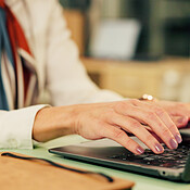 Laptop, typing and hands of business woman for report writing, email ...