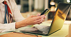 Business, hands and woman with phone by laptop at night for text message, notifications or chat. Office, working late and employee with smartphone for online research, internet browsing or networking